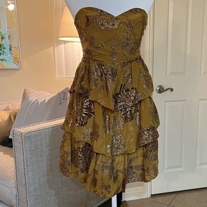 Anthropology, gold dress it’s a mini. Super cute.. it’s never been worn.